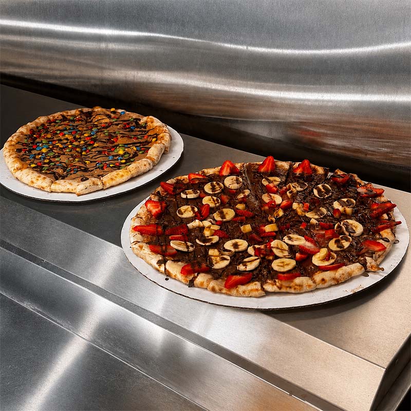 Fresh wood-fired pizza with crispy charred crust from Maple Wood Pizza truck