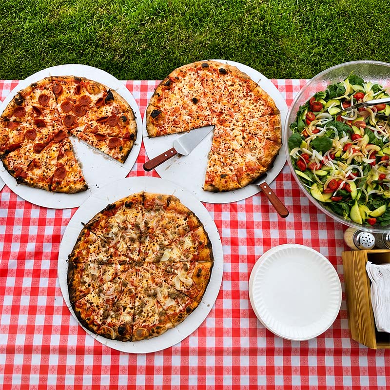 Maple Wood Pizza truck serving guests at a backyard party in Naugatuck CT