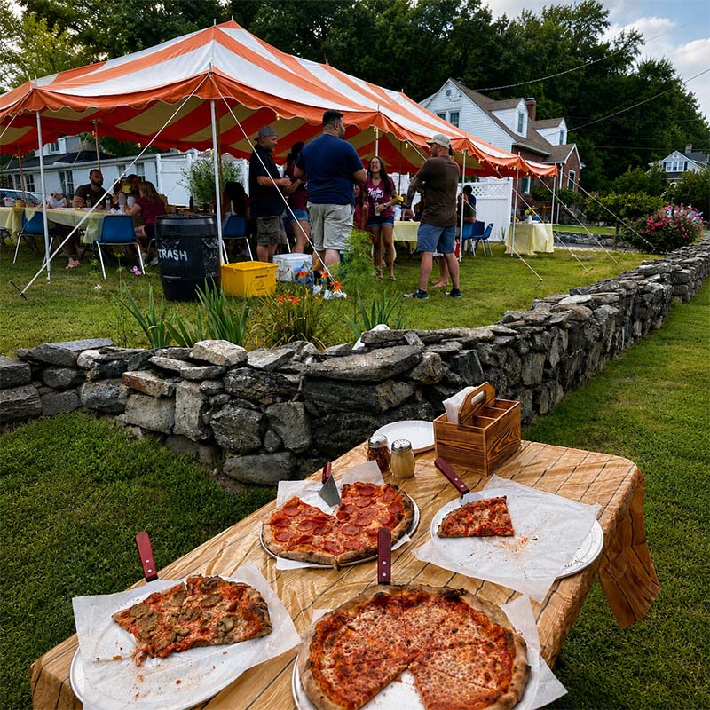 Wood-fired pizza being made on-site at a corporate event in Connecticut